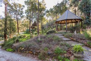 a gazebo in the middle of a garden at Lavenderpatch in Mundaring