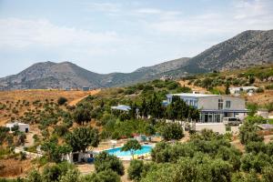 an aerial view of the villa with mountains in the background at Goknar Knidos Nature Hotel and Farm in Datca