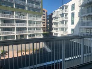 a balcony with a view of some buildings at Modern one bedroom apartment nearby Airport in Vantaa
