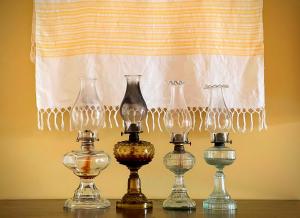 a group of glass vases sitting on a table at Casa da Japoneira in Horta
