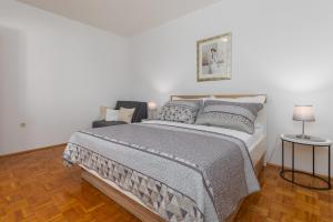 Postel nebo postele na pokoji v ubytování Villa Noa Mimice