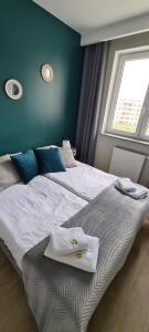 Ένα ή περισσότερα κρεβάτια σε δωμάτιο στο APARTAMENT SORENTO 28