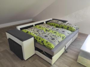 A bed or beds in a room at Domeček u lesa