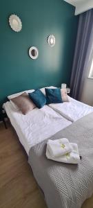 Ένα ή περισσότερα κρεβάτια σε δωμάτιο στο APARTAMENT SORENTO 27