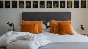 מיטה או מיטות בחדר ב-Unìco Boutique Hotel d'Arte