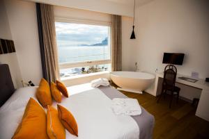 מיטה או מיטות בחדר ב-Unìco Boutique Hotel d'Arte