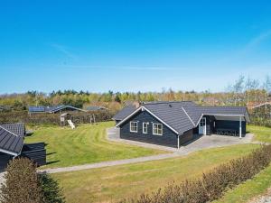 a home with a large yard with a house at Three-Bedroom Holiday home in Hemmet 13 in Hemmet