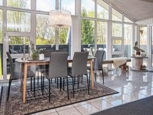a dining room with a table and chairs at 6 person holiday home in Hemmet in Falen