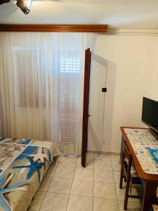 Postel nebo postele na pokoji v ubytování FUNTANA-MIA ROOMS B&B