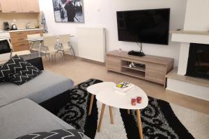 Televízia a/alebo spoločenská miestnosť v ubytovaní Panoramico View