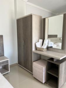 a bathroom with a sink and a mirror at Colibri in Kallithea Halkidikis +34 photos