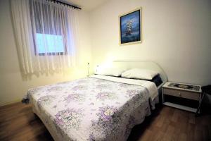 Postel nebo postele na pokoji v ubytování Apartment Leana Selce