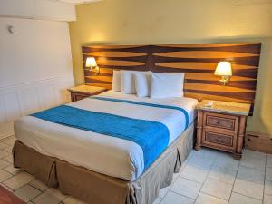 Postel nebo postele na pokoji v ubytování Quebec Motel