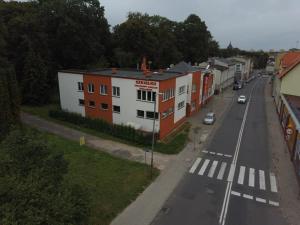 an overhead view of a city street with a building at Apartamenty "SZKIEŁKO" in Koszalin