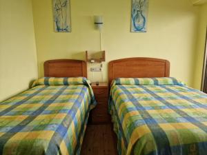 Cama o camas de una habitación en Pensión Tximistarri