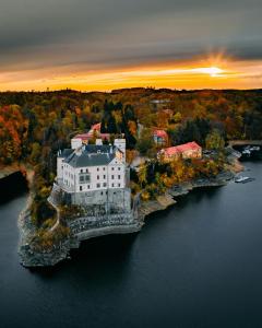 an aerial view of a house on an island in the water at Maringotka na samotě in Klučenice