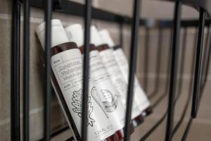 a bottle of wine sitting on a shelf at Alko Apartments in Mikonos