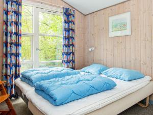 Postel nebo postele na pokoji v ubytování 8 person holiday home in Børkop-By Traum