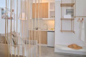 a small kitchen with a sink and a counter at Niriis Sea View Studio Melite Batsi in Batsi