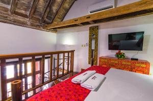 Postel nebo postele na pokoji v ubytování Casa Cordoba Román