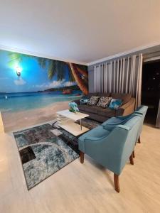 a living room with a couch and a view of the ocean at Lovely Condo 2 Bedrooms, 2 bathrooms, free 1 Parking at Waikiki Beach in Honolulu