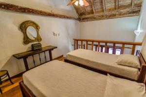 Postel nebo postele na pokoji v ubytování Casa Cordoba Román