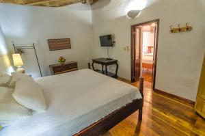 Postel nebo postele na pokoji v ubytování Casa Cordoba Román