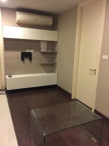 a room with a glass table in a room at Livat5r1042 in Makkasan