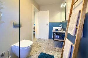 a bathroom with a toilet and a sink at Apartments Sol in Njivice