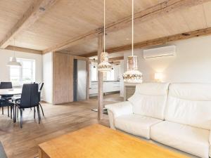 a living room with a white couch and a table at Apartment Faaborg II in Fåborg