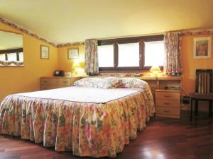 a bedroom with a bed and a window at B&B Piceno in Castel di Lama