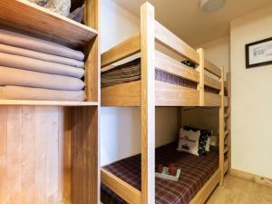 a closet with wooden bunk beds in a room at Appartement Saint-Lary-Soulan, 2 pièces, 6 personnes - FR-1-296-403 in Saint-Lary-Soulan