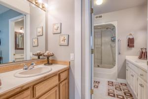 a bathroom with a sink and a shower at Whalers Rest in Depoe Bay