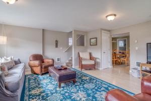 a living room with a couch and chairs and a table at Alpine Coast Cottage - Meredith Lodging in Rockaway Beach