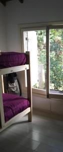 a room with two bunk beds and a window at Casa Balcón del Golf in Sierra de los Padres +42 photos