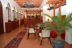 a restaurant with a table and chairs in a room at Popova Kula Hotel & Winery in Demir Kapija