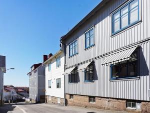 a white building with windows on the side of it at Holiday home LYSEKIL XXVII in Lysekil