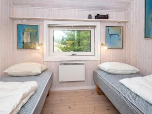 Кровать или кровати в номере 8 person holiday home in Fanø-By Traum