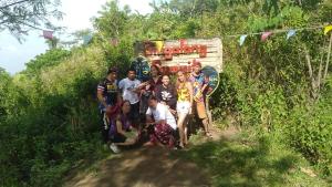 a group of people posing for a picture on a trail at Raw Camping at Camping Paradise Singalong Mountain Garden in Antipolo