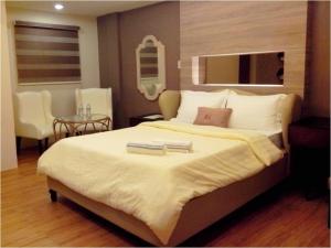 Voodi või voodid majutusasutuse Malabon Grand Hotel and Events Place toas