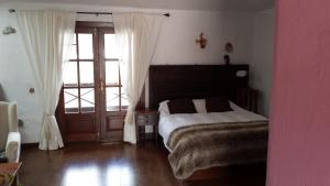 Tempat tidur dalam kamar di Villa Rural Gloria´s
