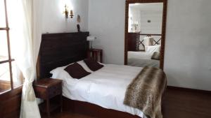 Tempat tidur dalam kamar di Villa Rural Gloria´s