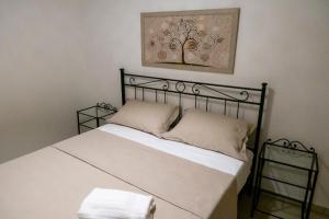 Postel nebo postele na pokoji v ubytování Le Dimore di Corte Madama