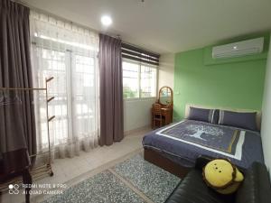 A bed or beds in a room at Qianshun Homestay