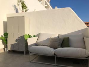 a couch sitting on top of a patio at Tarifa Sol y Sal in Tarifa
