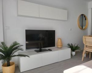 A television and/or entertainment centre at Tarifa Sol y Sal