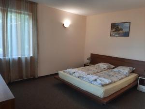 Postel nebo postele na pokoji v ubytování Hotel Orchidea