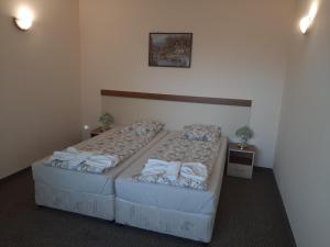 Postel nebo postele na pokoji v ubytování Hotel Orchidea