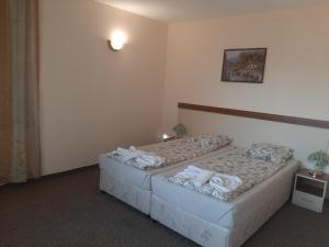 Postel nebo postele na pokoji v ubytování Hotel Orchidea