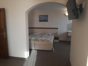 Postel nebo postele na pokoji v ubytování Hotel Orchidea